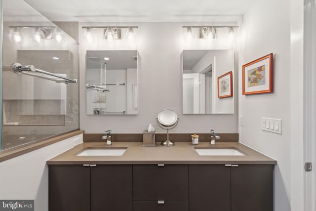 bathroom featuring vanity and a shower