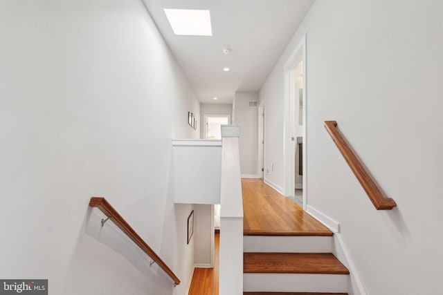 stairway with a skylight