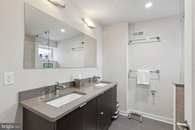 bathroom with vanity and tile patterned floors