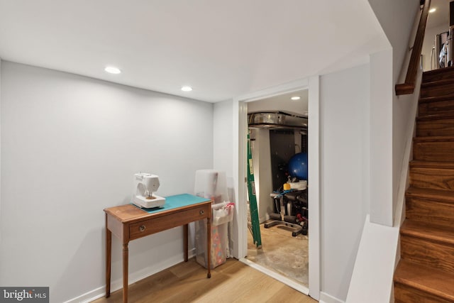 corridor featuring hardwood / wood-style floors