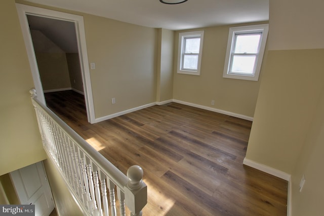 unfurnished room with dark hardwood / wood-style floors