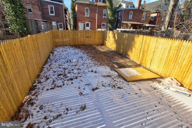 view of yard layered in snow