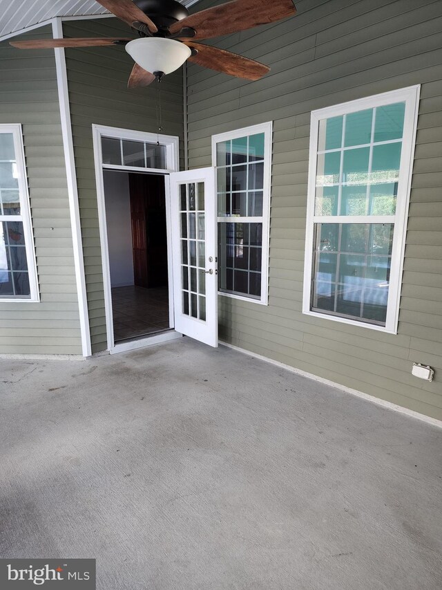 view of patio with french doors and a ceiling fan