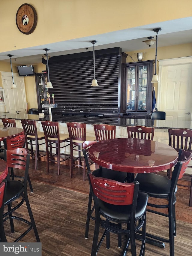 dining area with dark wood-style floors