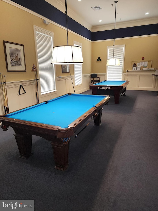 game room featuring billiards, visible vents, wainscoting, crown molding, and dark carpet