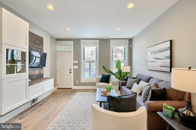 living room with light hardwood / wood-style flooring