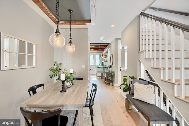 dining space with light hardwood / wood-style flooring