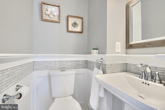 bathroom with sink and toilet