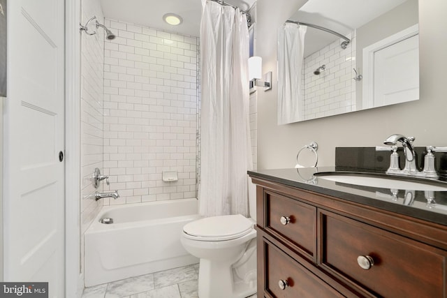 full bathroom featuring vanity, toilet, and shower / tub combo