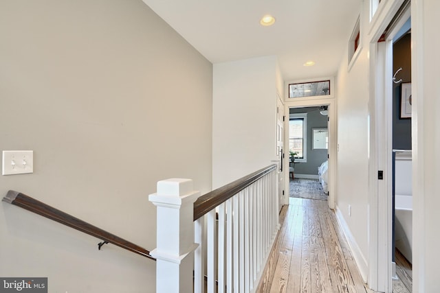 hallway with light hardwood / wood-style flooring