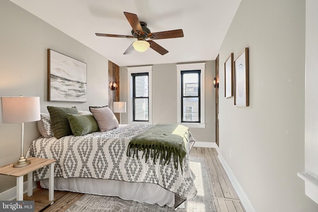 bedroom featuring hardwood / wood-style floors and ceiling fan