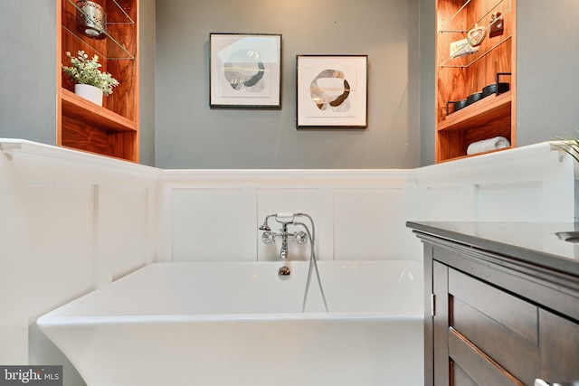 bathroom with a bathtub and vanity