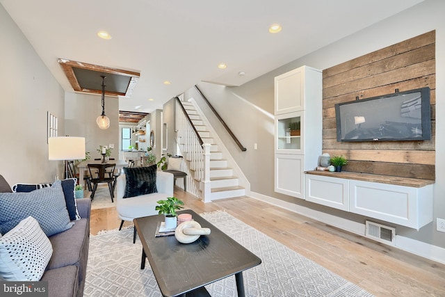 living room with light hardwood / wood-style flooring