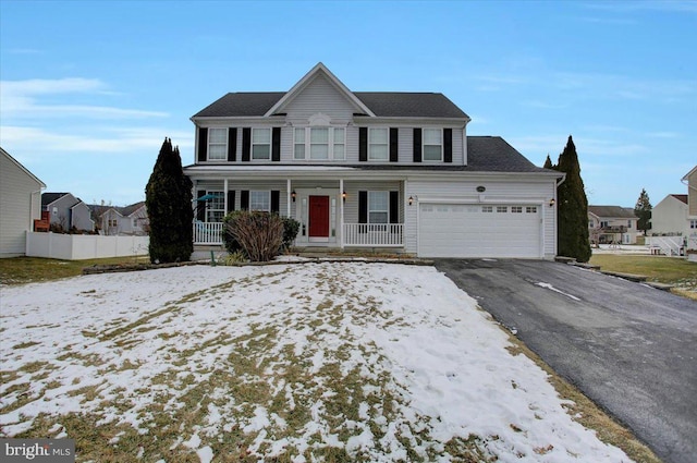 front facade with a porch and a garage