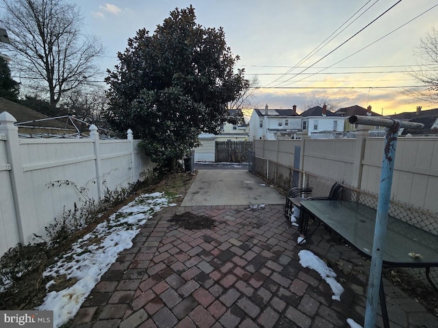 view of patio terrace at dusk