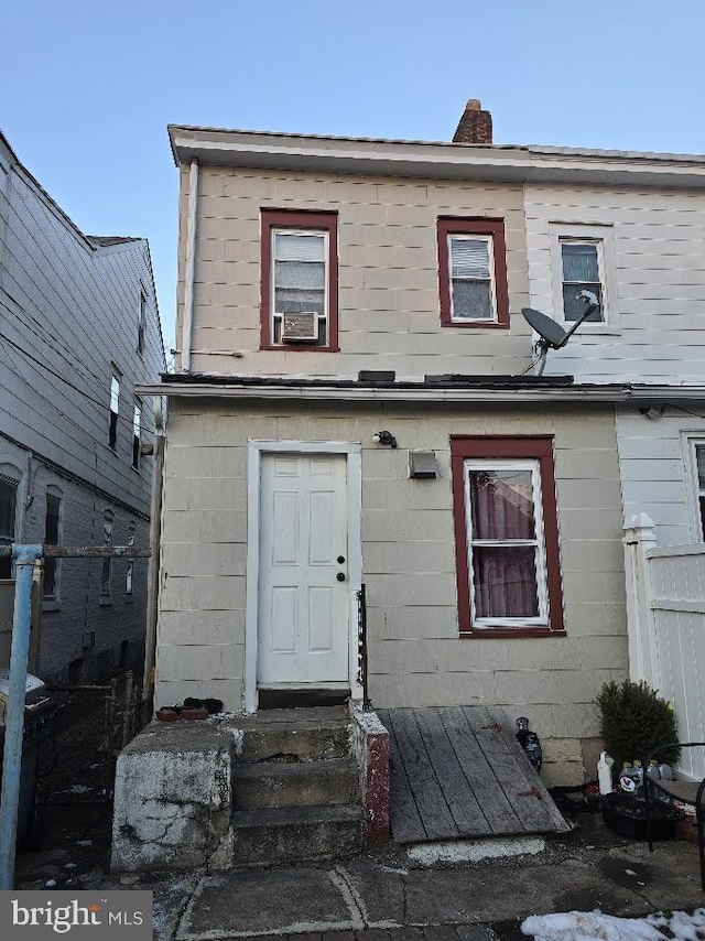 view of front of property with cooling unit