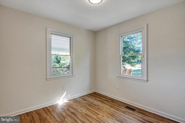 spare room with light wood-type flooring