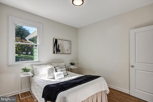 bedroom featuring dark wood-type flooring