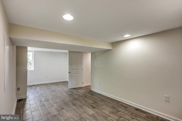 basement featuring hardwood / wood-style floors