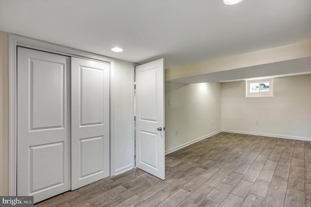 basement featuring light wood-type flooring