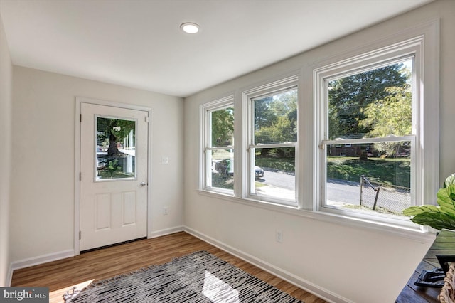 doorway to outside with hardwood / wood-style flooring