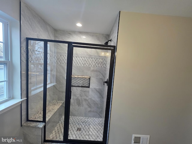 bathroom with recessed lighting, visible vents, and a stall shower