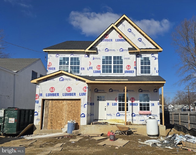 unfinished property featuring covered porch