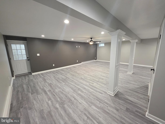 below grade area featuring recessed lighting, baseboards, and wood finished floors