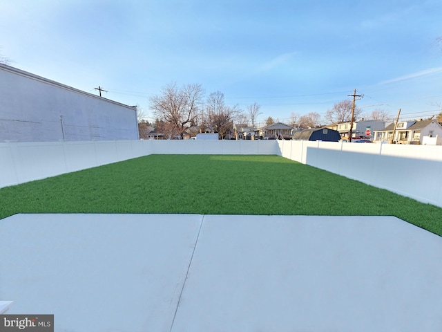 view of yard with a fenced backyard