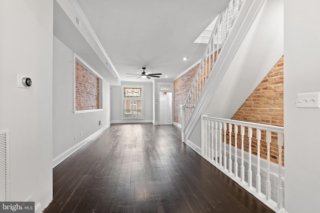 hallway featuring dark wood-type flooring and ornamental molding