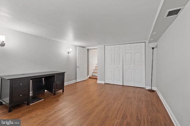 basement with wood-type flooring