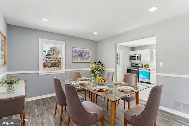 dining space featuring light hardwood / wood-style floors