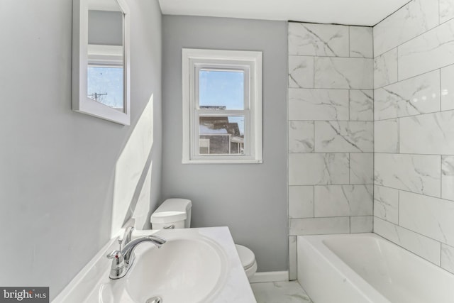 bathroom featuring sink and toilet