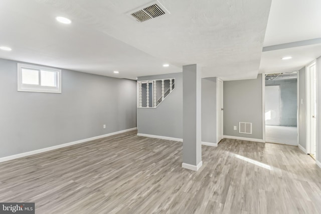 basement featuring light hardwood / wood-style flooring