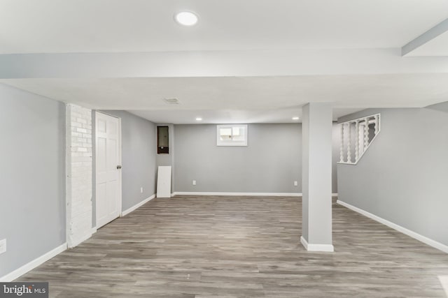 basement featuring wood-type flooring