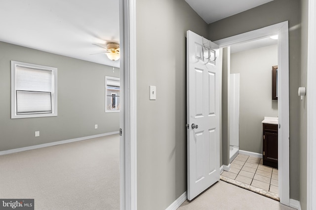 bathroom featuring vanity, tile patterned flooring, and ceiling fan