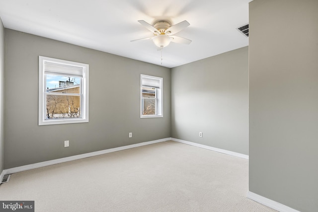 empty room with light carpet and ceiling fan