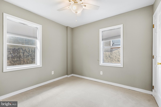 carpeted empty room with ceiling fan