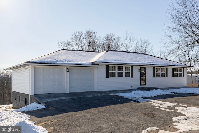 ranch-style house featuring a garage