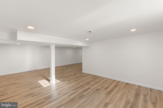 basement featuring light hardwood / wood-style flooring