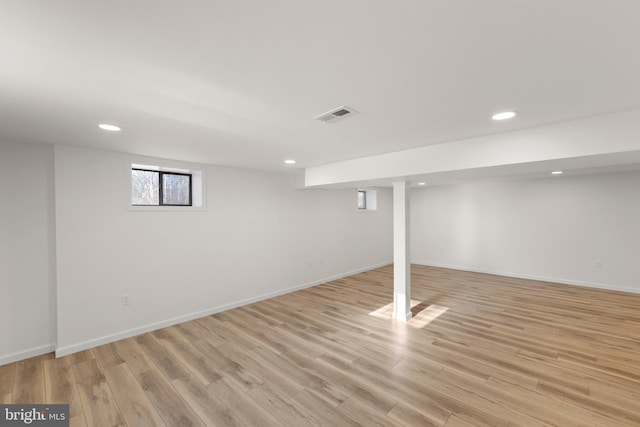 basement featuring light wood-type flooring