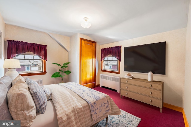 bedroom with vaulted ceiling and radiator heating unit