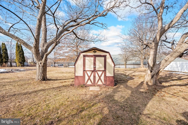 view of outdoor structure featuring a lawn