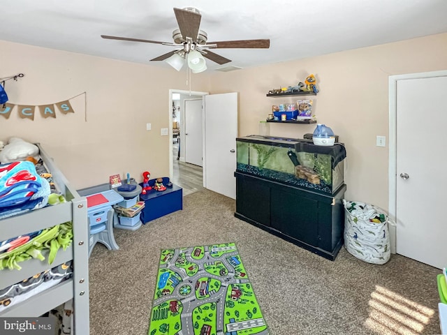 playroom featuring carpet flooring and ceiling fan