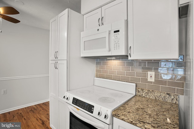 kitchen with white cabinets, stone counters, tasteful backsplash, electric range, and dark wood-type flooring