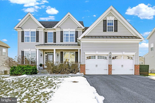 view of front of house featuring covered porch and a garage