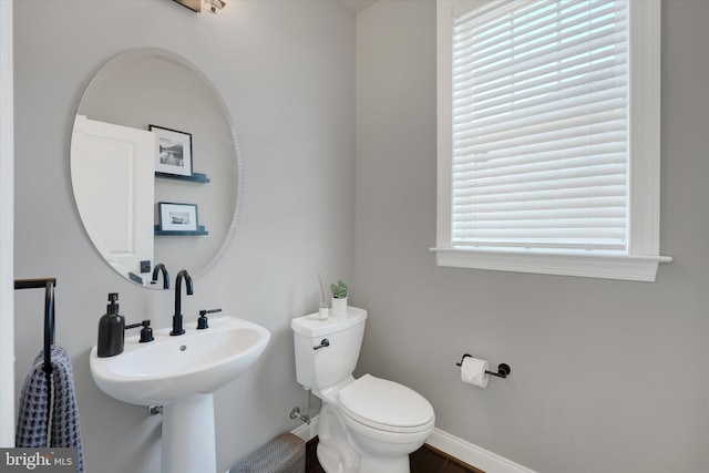 bathroom featuring toilet and sink