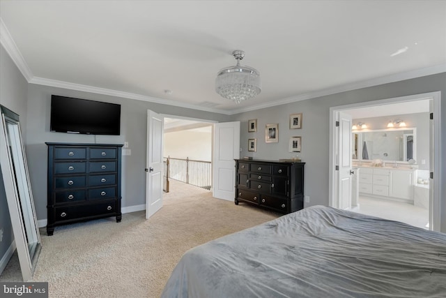 carpeted bedroom with ensuite bath, crown molding, and a chandelier