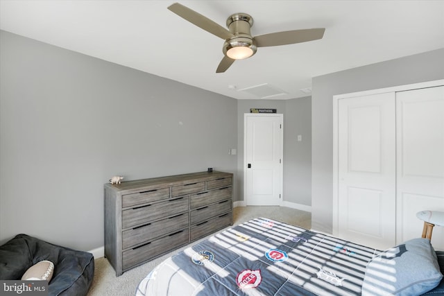 carpeted bedroom featuring a closet and ceiling fan