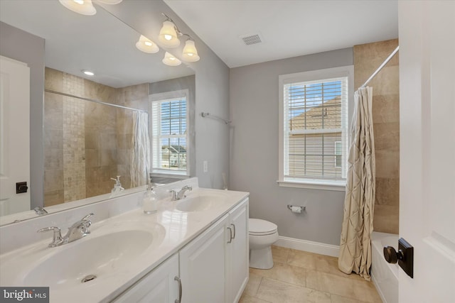 full bathroom with toilet, tile patterned flooring, a healthy amount of sunlight, and shower / tub combo with curtain